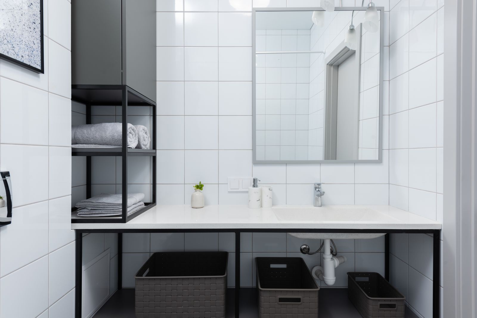 A clean bathroom counter and mirror