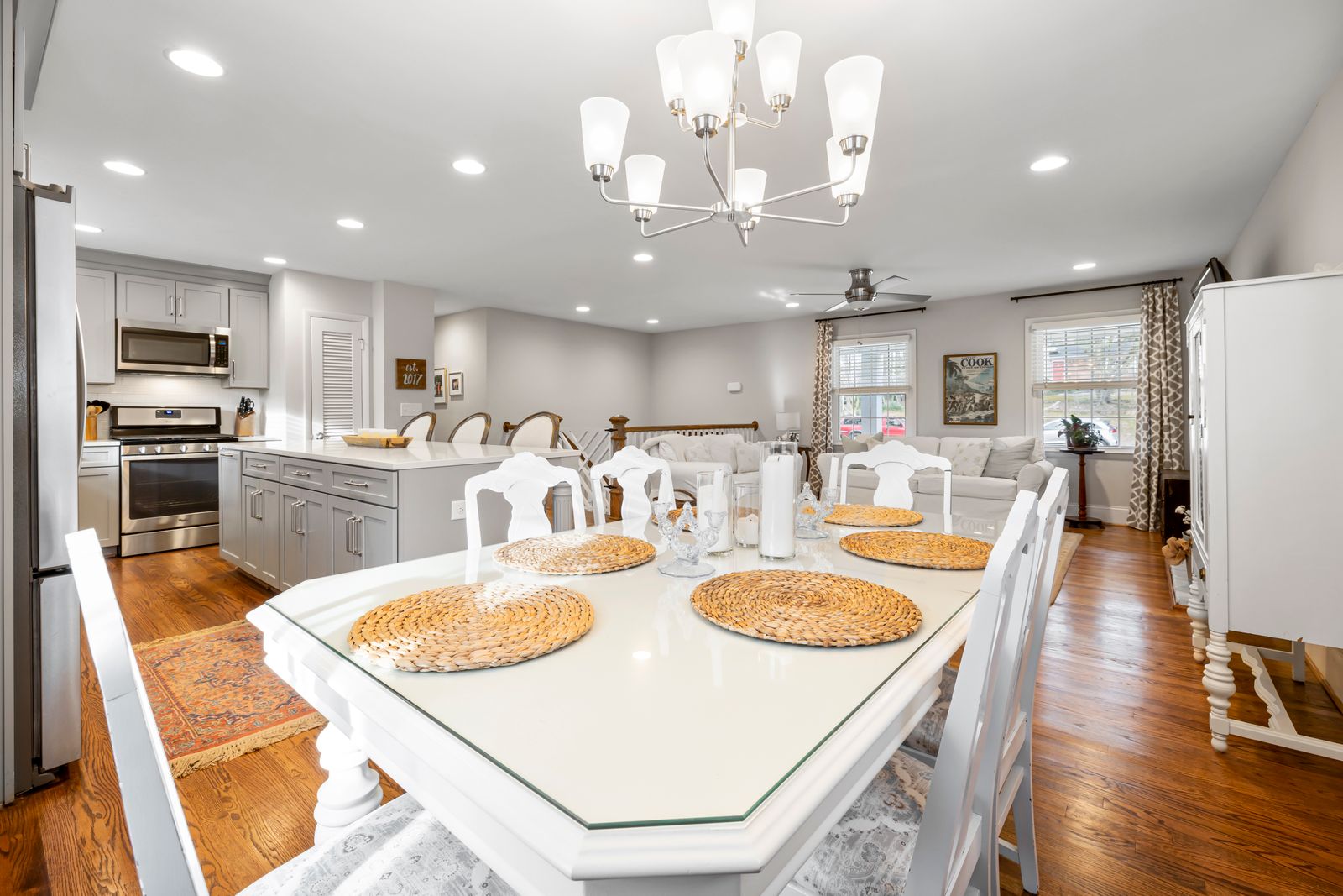 A clean dining table laid out in a bright room